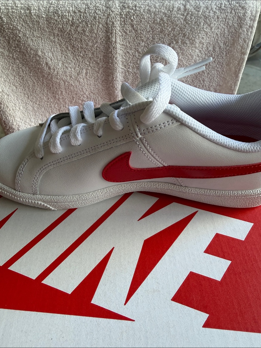 Nike White Low-Top Sneakers with Red Swoosh